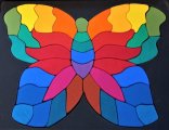 Wooden toys A colourful wooden puzzle in the shape of a butterfly