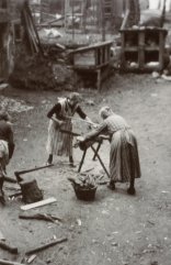 Women at work A black-and-white photograph of two women sawing wood