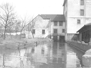 A black-and-white photograph of a ditch.