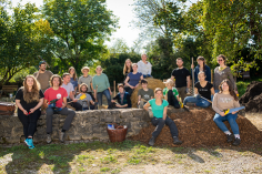 A group photo of a group of young people with pitchforks