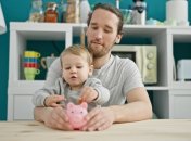 Father,And,Son,Inserting,Coin,On,Piggy,Bank,Sitting,On Father,And,Son,Inserting,Coin,On,Piggy,Bank,Sitting,On