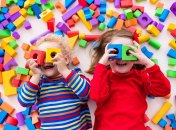 Happy,Preschool,Age,Children,Play,With,Colorful,Plastic,Toy,Blocks.