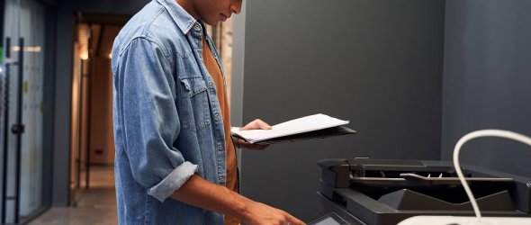 Portrait,Of,Curly,Office,Confident,Worker,Is,Printing,A,File