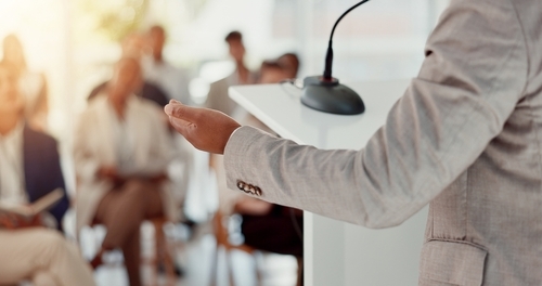 Businessperson,,Microphone,Or,Hand,Of,Speaker,In,Seminar,For,Education,